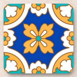 May include: Square coaster with a vibrant, symmetrical design. The coaster features a central blue square with a yellow floral pattern. White, yellow, and teal accents create a decorative border. The coaster has rounded corners.