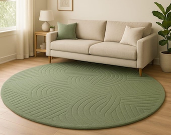 Alfombra redonda de lana verde salvia, tejida a mano, de estilo escandinavo moderno.