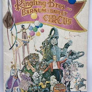 May include: A vintage Ringling Bros. and Barnum & Bailey Circus souvenir magazine and program from the 99th season. The cover features colorful illustrations of circus performers, an elephant, a tiger, a horse, and a clown with balloons.