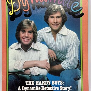 May include: A vintage Dynamite magazine, issue number 41, featuring a cover photograph of two individuals smiling against a blue background. The title Dynamite is printed in large, colorful letters at the top, and the text The Hardy Boys: A Dynamite Detective Story! appears at the bottom.