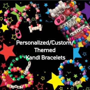 May include: A collection of colorful Kandi bracelets with star and word bead accents. The bracelets feature various color combinations, including pink, black, white, green, yellow, blue, and purple. Text on the bracelets includes "KIRBY", "ALIEN", and "ZZZ".
