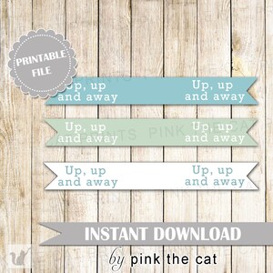 May include: Printable digital download of three banners with the text "Up, up and away" in blue, green, and white on a wood background. The text "INSTANT DOWNLOAD by pink the cat" is at the bottom of the image.