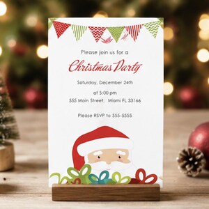 Puede incluir: Una tarjeta de invitaci&oacute;n rectangular blanca con una guirnalda de banderines rojos y verdes en la parte superior, una ilustraci&oacute;n de Santa Claus en la parte inferior y el texto: Please join us for a Christmas Party, Saturday, December 24th, at 5:00 pm, 555 Main Street, Miami FL 33166, Please RSVP to 555-5555.