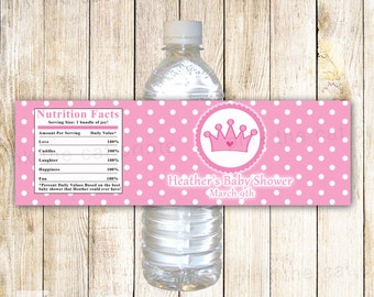 May include: Pink and white polka dot water bottle label with a pink crown and the text "Heather's Baby Shower March 9th".