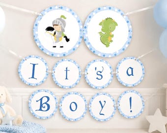 May include: A decorative banner featuring circular cards with blue polka dot borders. The top row displays a knight on a horse and a green dragon. The bottom rows spell out the text 'It's a Boy!' in blue lettering, all strung together on white ribbon.