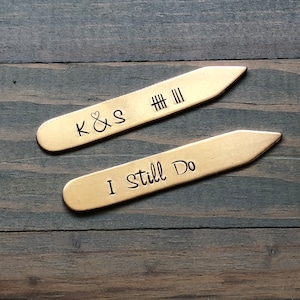 May include: Two gold-colored collar stays with engraved text. The top stay reads "K&S # # # III" and the bottom stay reads "I Still Do".