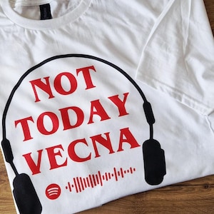 May include: White t-shirt featuring the red text "NOT TODAY VECNA" within a black headphone outline. A Spotify logo and a barcode graphic are also present. The shirt is made of a soft material.