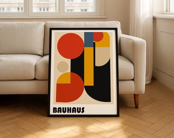 May include: A framed wall art print featuring a geometric composition of circles and rectangles in red, yellow, blue, black, and beige. The design includes a large red circle, a yellow vertical bar, and the word BAUHAUS in bold black lettering at the bottom.