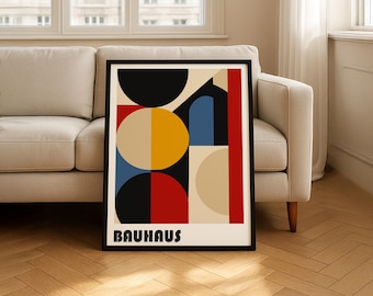 May include: A framed rectangular wall art print featuring a geometric composition of circles and rectangles in black, red, yellow, blue, and beige. The word BAUHAUS is printed in bold black sans-serif capital letters at the bottom of the print.