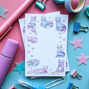 May include: A set of 8 pastel purple and blue cat stickers on a white background. The cats are depicted in a variety of poses, including sleeping, sitting, and standing. The stickers are perfect for adding a touch of whimsy to your planner, laptop, or water bottle.