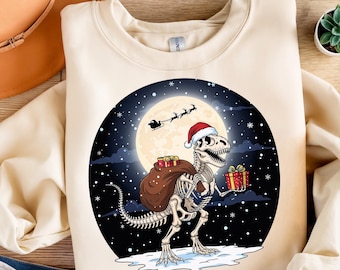 Funny Christmas T-Rex Skeleton Clipart – Santa Dinosaur with Gifts PNG, Xmas Sublimation Design, Holiday Dino Art