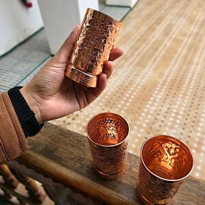 Set of three copper tumblers shown as a 7th wedding anniversary gift.