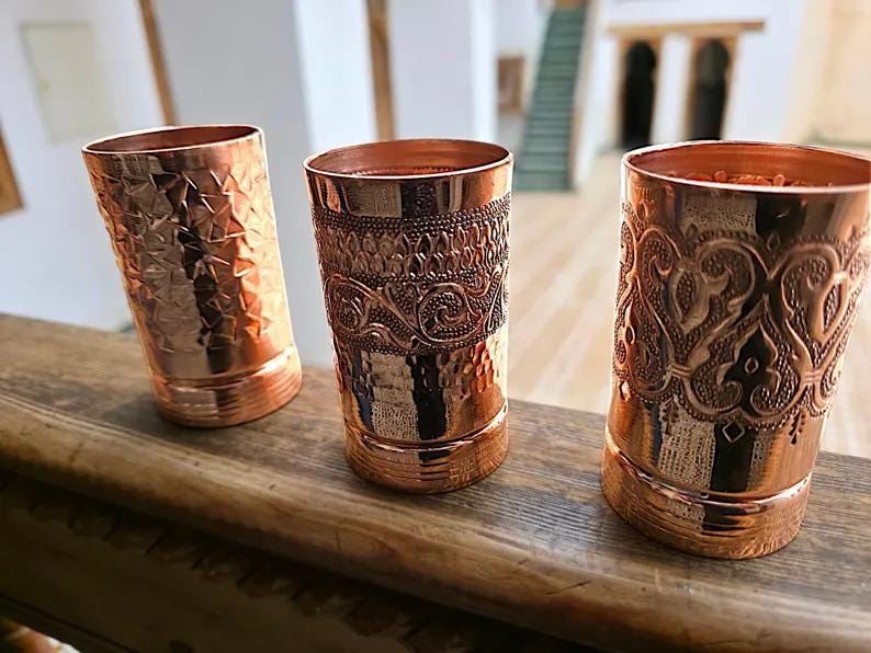 Pure copper tumblers set of 3 with distinct embossed and hammered patterns.