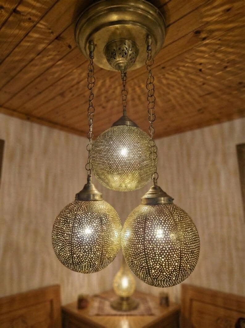 Boho style bedroom lighting fixture with gold finish.