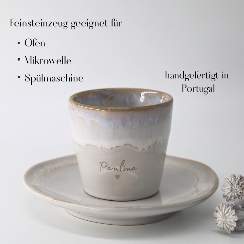 May include: A ceramic mug and saucer set. The mug is light gray with a white and brown rim, and the name "Paulina" is written on the front. The saucer is a matching light gray color. The text "handgefertigt in Portugal" is visible.