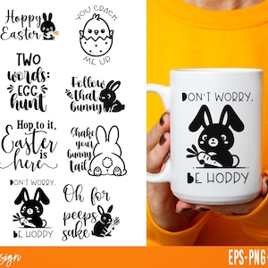 May include: White ceramic mug with a black bunny graphic holding a carrot, and the text "DON'T WORRY, BE HODDY". The image also shows various Easter-themed designs with bunnies and text.