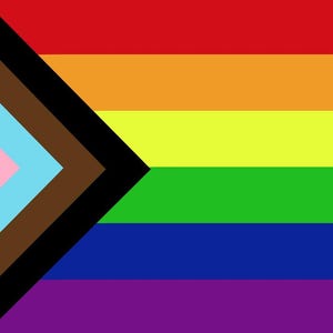 May include: A colorful flag featuring horizontal stripes in red, orange, yellow, green, blue, and purple. A black chevron points to the right, with a light blue, pink, white, and brown chevron on the left.