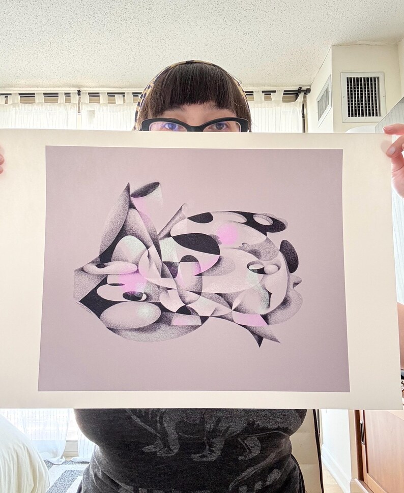 May include: Abstract art print with a complex arrangement of geometric shapes in black, white, and pink. The artwork has a soft, diffused appearance, with subtle shading and highlights. The print is displayed on a light pink background.