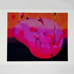 May include: Abstract art print featuring a large, biomorphic shape in shades of pink and red against an orange and black background. The artwork has a textured appearance and is framed in a white border.