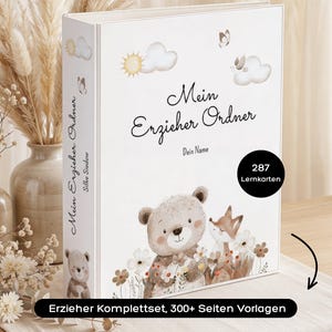 Könnte beinhalten: Ein weißer Ordner mit dem Titel Mein Erzieher Ordner und einer Aquarellillustration eines Bären und eines Fuchses zwischen Blumen, Wolken und einer Sonne. Das Cover enthält den Text Dein Name und ein schwarzes Abzeichen mit 287 Lernkarten.