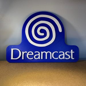 Enseigne / présentoir avec logo Dreamcast 23 cm - SEGA / Rétro / Homme des cavernes