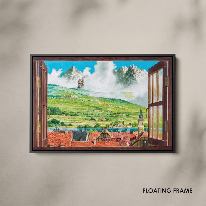 May include: A framed artwork depicts a vibrant landscape scene viewed through an open window. The artwork showcases a town with red-tiled roofs, green hills, and majestic mountains under a blue sky. The words "FLOATING FRAME" are at the bottom.