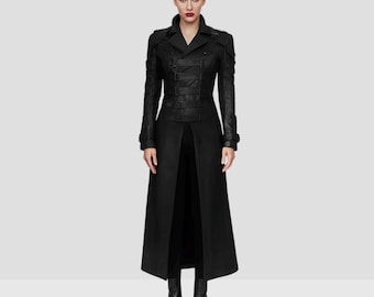 May include: A long, black coat with a military-inspired design. The coat features a double-breasted front with multiple straps and buckles, a notched collar, and long sleeves. The coat is floor-length and has a split in the back.