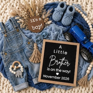 May include: A baby announcement with a denim overall, blue knitted booties, and a toy tractor. A wooden sign says "it's a boy!" and a letter board announces "A Little Brother is on the way! November 2026."