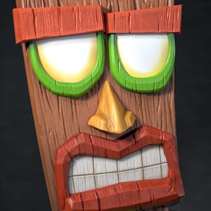 Peut inclure: Un masque tiki en bois sculpté avec un design détaillé. Le masque présente une base marron avec des accents rouges, verts et jaunes. Les yeux sont blancs avec des contours verts et jaunes, et la bouche est ouverte, révélant des dents blanches.