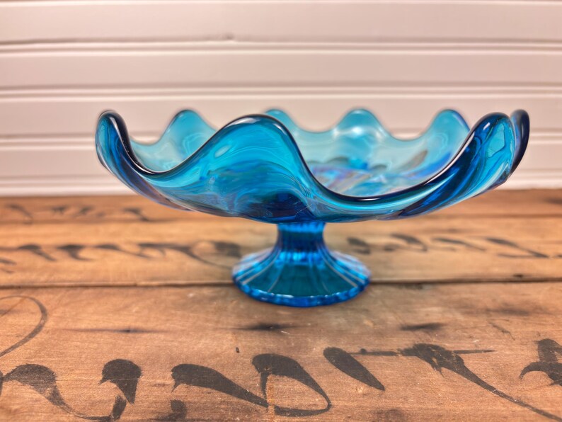 vintage glass bowl, le smith glass, mid century modern decor, blue pedestal bowl, ruffled glass bowl, retro home decor, mcm centerpiece, vintage candy dish, peacock blue glass, 1960s glassware, pressed glass, vintage gift idea, collectible glass bowl, footed compote