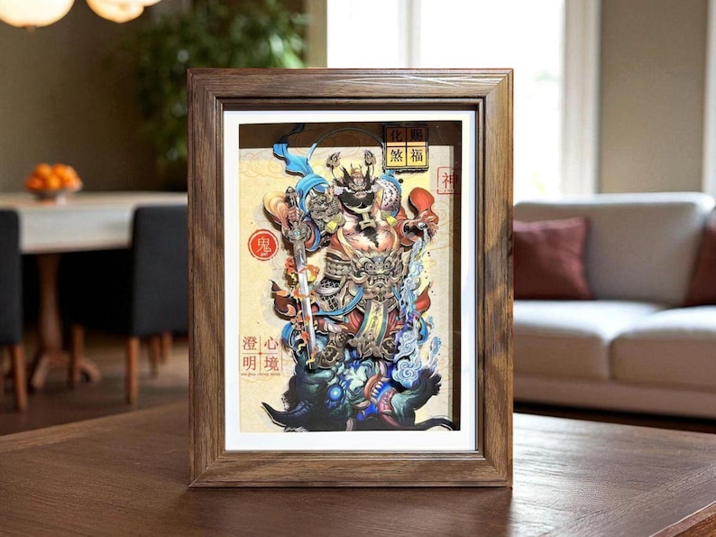 May include: A framed artwork featuring a detailed, colorful illustration of a warrior figure. The artwork has a 3D effect, with layers creating depth. The frame is made of dark wood. The artwork includes Japanese text.