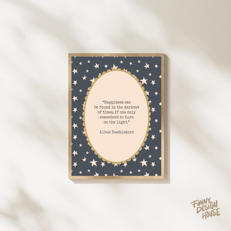 May include: A framed print with a navy blue background covered in white stars. The print features a light peach oval with a gold scalloped border containing a quote by Albus Dumbledore. The words "FUNNY DESIGN HOUSE" are in the bottom right corner.