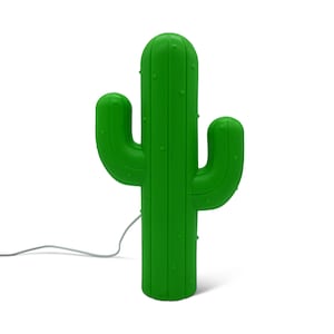 May include: A bright green cactus-shaped lamp with two side arms and a central column. The lamp has a smooth surface with small, evenly spaced bumps. A gray power cord extends from the base. The lamp is a decorative lighting fixture.