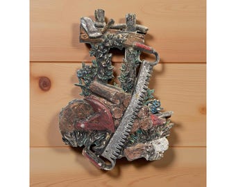 Vintage 1976 Sexton Hoda Metal Wall Plaque Depicting a farmer's hard day of woodcutting