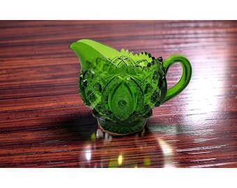 vintage 1960's-1970's  indiana pressed glass green beautifully decorated creamer jar.