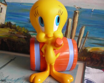 Vintage Tweety Bird Bank.  Soft Plastic. Tweety With a Huge Barrel Mallet. Made by Applause for Warner Bros in 1997. 8 Inches (20 cm ) Tall.