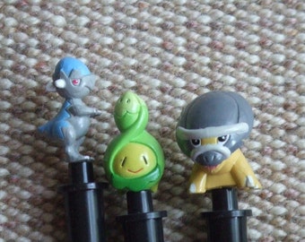 Very rare. From 2008. Lot of 3 Pokemon Pencils With Pokemon Toppers. Original and Genuine. Shieldon, Budew and Cranidos.