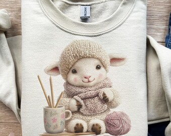 Cordero acogedor, escena de tejido, invierno acogedor, lana suave, taza de té, crema pastel, cálido navideño, diseño de camiseta, dtf, sublimación, PNG navideño