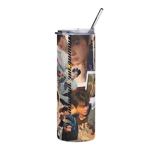 May include: A stainless steel tumbler with a collage of images of a person. The tumbler has a clear lid and a metal straw. The images show the person in different poses and outfits, with some text visible.