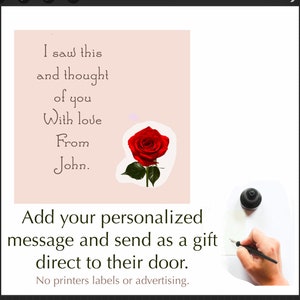 May include: A light pink card with a handwritten message that reads "I saw this and thought of you With love From John." A red rose is on the card. The text "Add your personalized message and send as a gift direct to their door. No printers labels or advertising." is below the card.