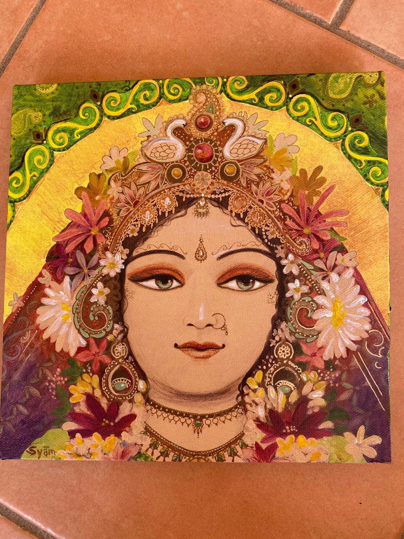 May include: A painting of a woman with a golden crown and flowers in her hair. She has green eyes and is wearing a gold necklace. The background is a golden yellow with green swirls.