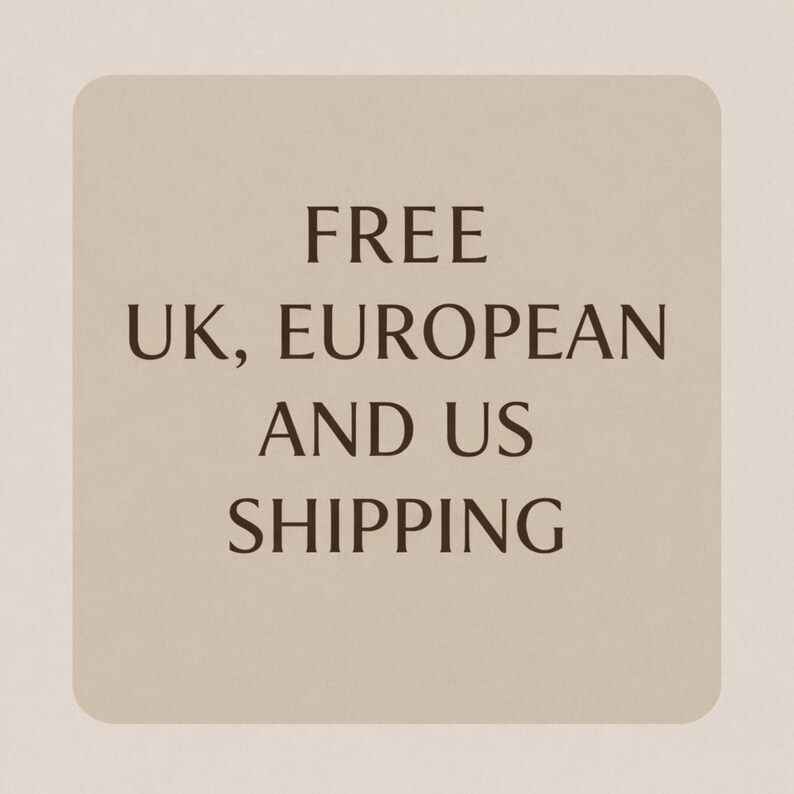 May include: A beige rectangular card with rounded corners displays the words "FREE UK, EUROPEAN AND US SHIPPING" in a dark brown font. The text is centered on the card.