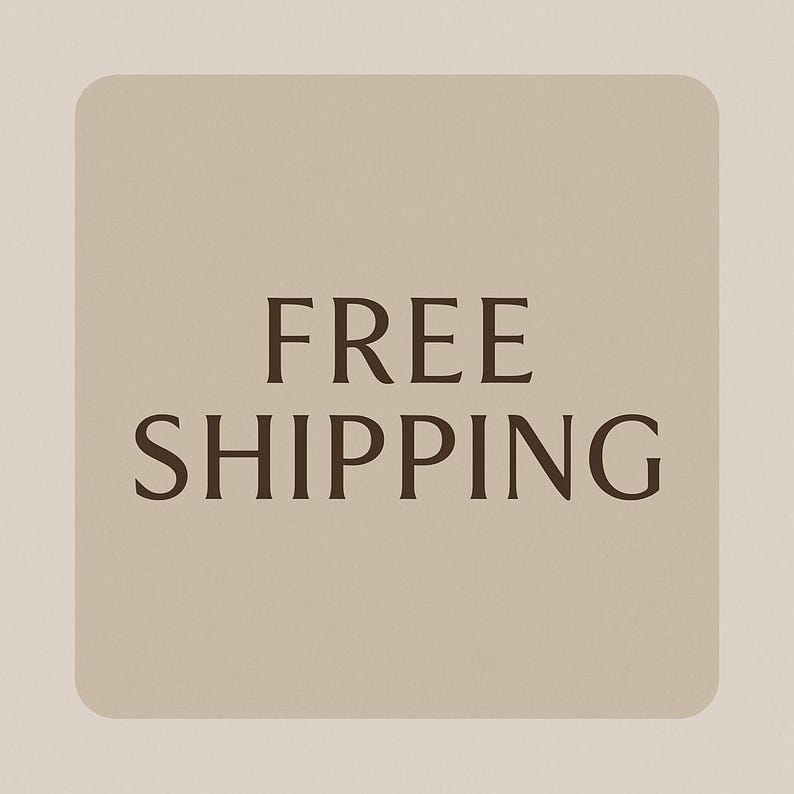 May include: A square, beige graphic with rounded corners displays the words "FREE SHIPPING" in a dark brown, bold font. The text is centered on the graphic, which is set against a lighter beige background.