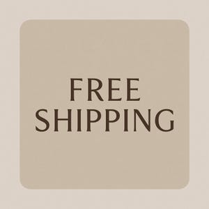 May include: A square graphic with rounded corners featuring a light beige background and the text FREE SHIPPING in dark brown, capitalized, serif font centered in the middle of the image. The design is simple, clean, and uses high contrast.