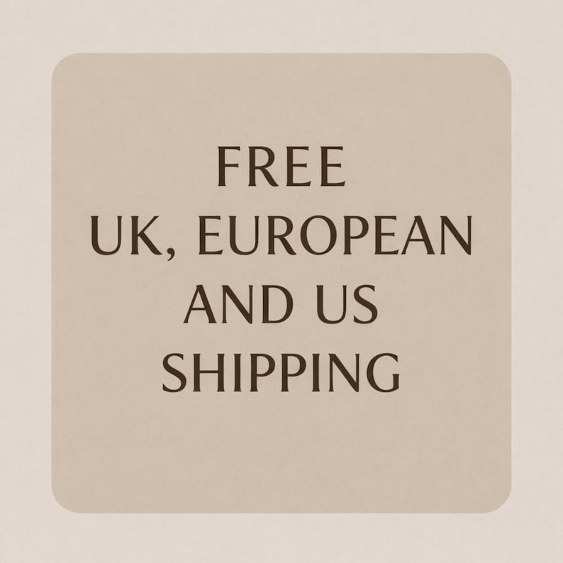 May include: A beige rectangular card with rounded corners displays the words "FREE UK, EUROPEAN AND US SHIPPING" in a dark brown font. The text is centered on the card.