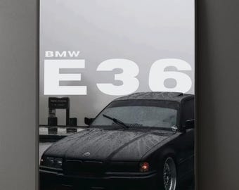 May include: Black BMW E36 car poster. The poster features a black car with the text "BMW E36" in white. The car is parked in front of a parking sign. The image has a moody, overcast aesthetic.