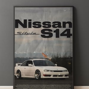 May include: Framed poster featuring a white Nissan Silvia S14 sports car. The poster has the car's name in large black letters, with the model name below. The background is a faded, vintage-style image.