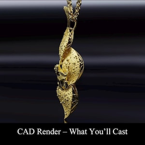 May include: A gold-colored pendant necklace with a detailed, organic design. The pendant features a flowing, abstract shape with textured surfaces and a small figure. The chain is also gold and complements the pendant. The text "CAD Render - What You'll Cast" is at the bottom.