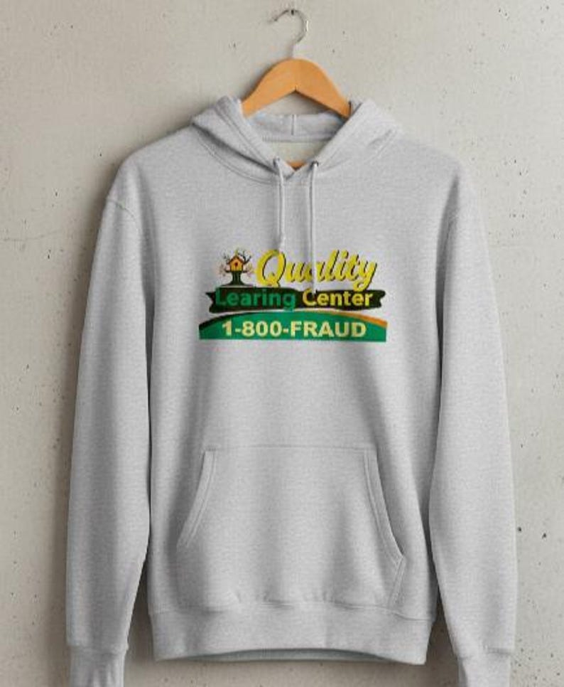 May include: A light gray hoodie with a front pocket and a drawstring hood. The front features a graphic with the words "Quality Learing Center" and "1-800-FRAUD" in yellow, green, and orange.