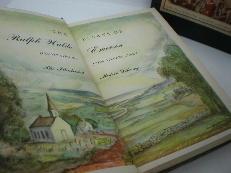 Pode incluir: Um livro aberto intitulado "The Essays of Emerson" de Ralph Waldo Emerson, ilustrado por John Steuart Curry. A capa do livro apresenta uma pintura em aquarela de uma cena campestre com uma igreja, &aacute;rvores e uma parede de pedra.